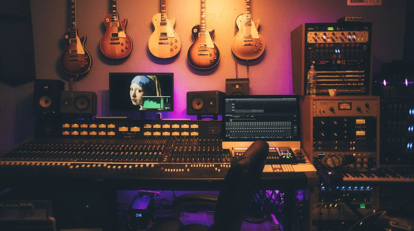 Acoustics engineer analyzing 3D spectral decay waterfall plots and axial room modes in a treated high-end listening room with bass traps